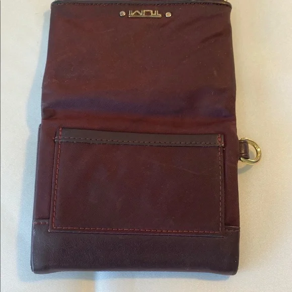 TUMI Dark Red Leather Wallet with Gold Accents - Picture 4 of 10